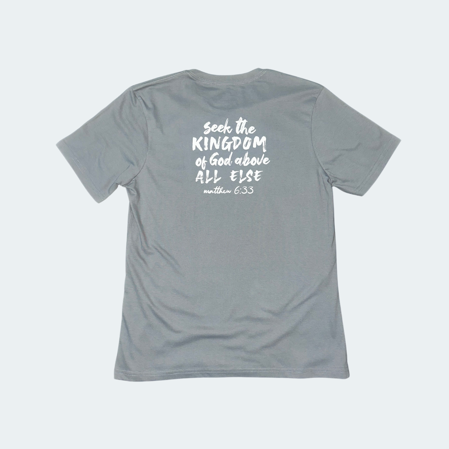 Gray t-shirt with white text on the back on a light gray background