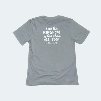 Gray t-shirt with white text on the back on a light gray background