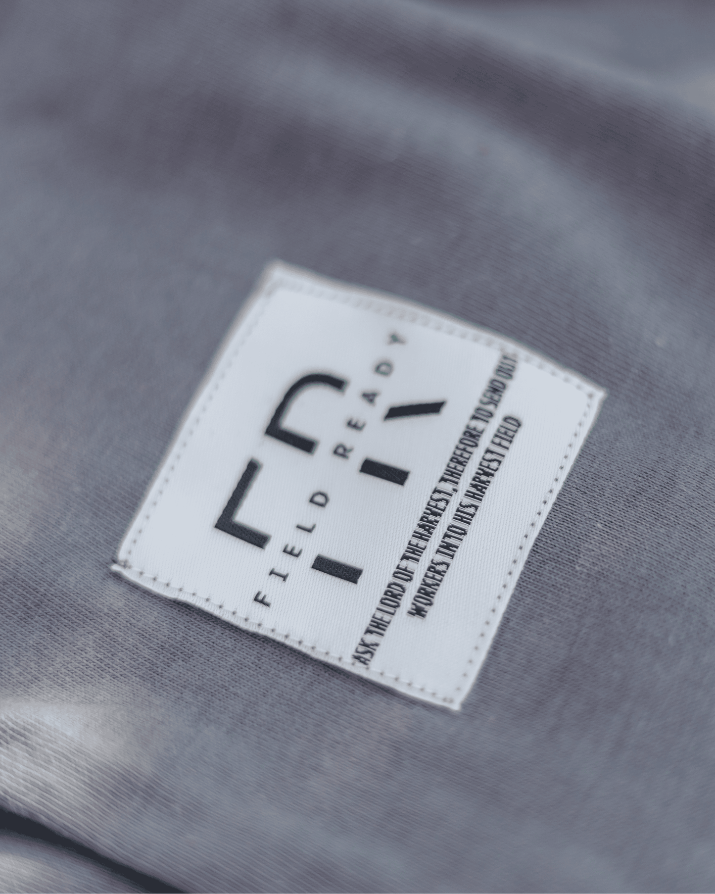 Label with 'Field Ready' branding on a gray fabric background